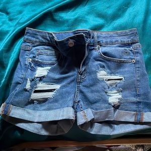 Blue ripped jean shorts